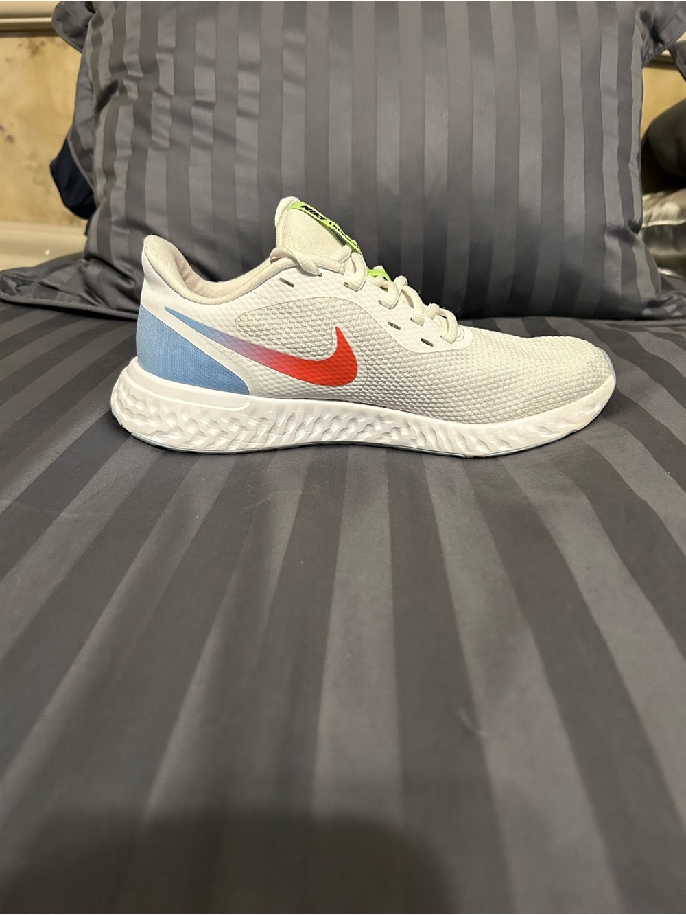Nike Women's White Sneakers with bold pink Swoosh and Light Blue Heel Accent